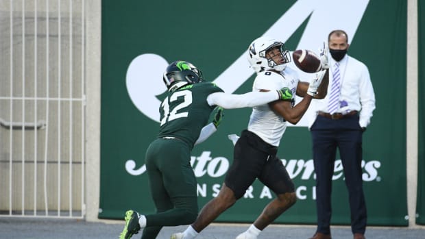 Northwestern Wildcats wide receiver Kyric McGowan (8) is unable to make a catch against Michigan State Spartans cornerback Chris Jackson (12) during the second quarter at Spartan Stadium. Tim Fuller-USA TODAY Sports